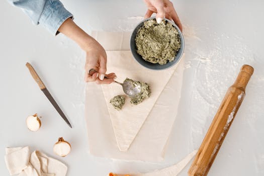 A chef experimenting with food combinations in a modern kitchen