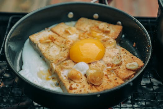 sizzling bacon in a frying pan