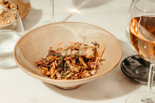 image of a chef preparing food with wine