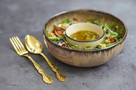 a colorful salad drizzled with vinaigrette