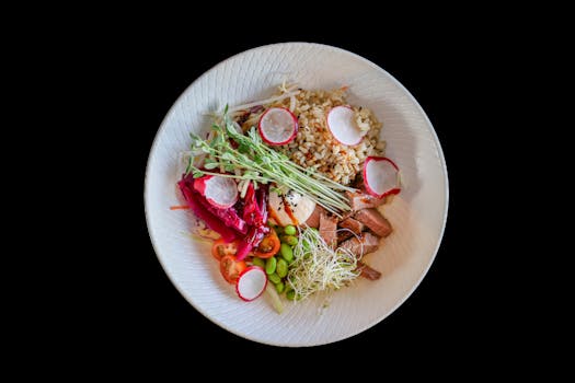 colorful vegan bowl with grains and vegetables